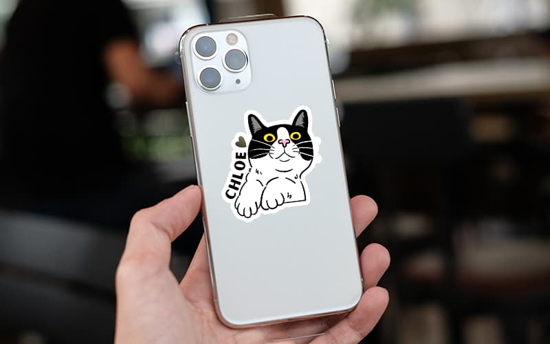 Cute cat die-cut sticker on phone